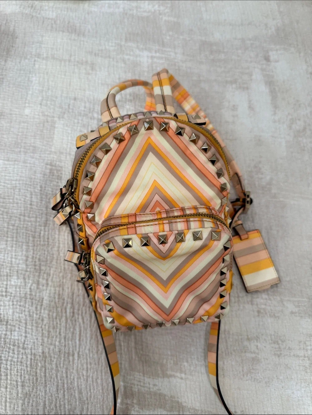 Valentino Garavani Striped Chevron Mini Backpack in Peach, Cream & Tan - Picture 1 of 3